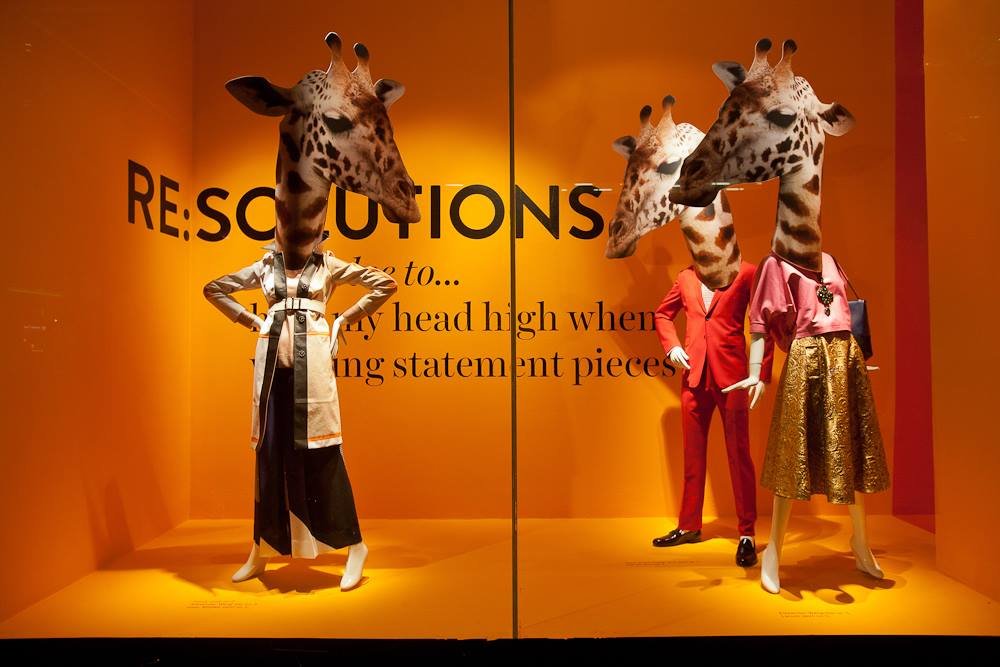 Mannequins with giraffe heads.