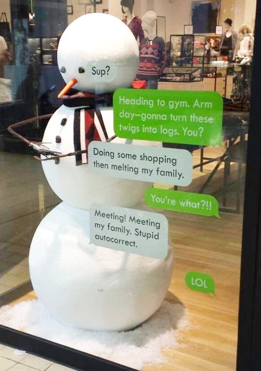 Snowman display with texts on the window.